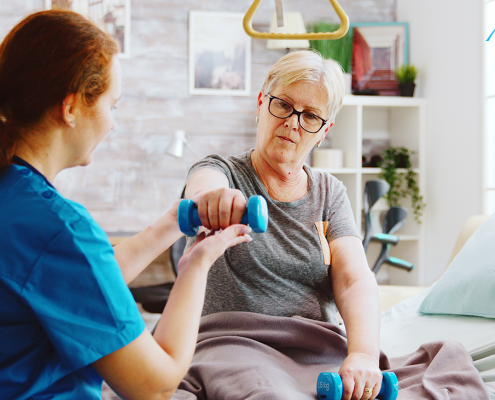 Therapist demonstrating proper posture during physio.