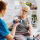 Therapist demonstrating proper posture during physio.