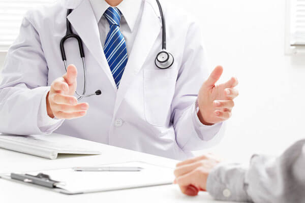 Doctor Doctor signing a form