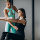 Therapist demonstrating proper posture during physio.