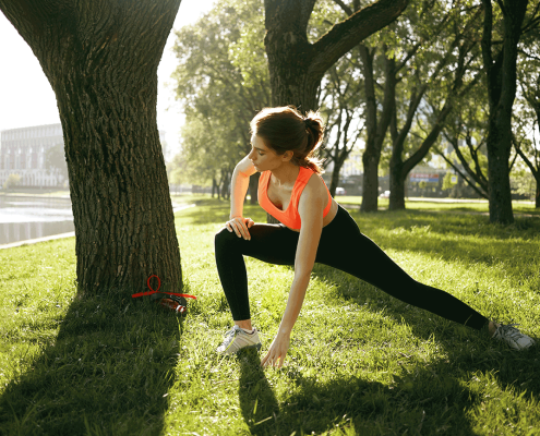 Woman doing kinesiology exercises at the park