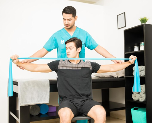 Patient using resistance bands in physical therapy.